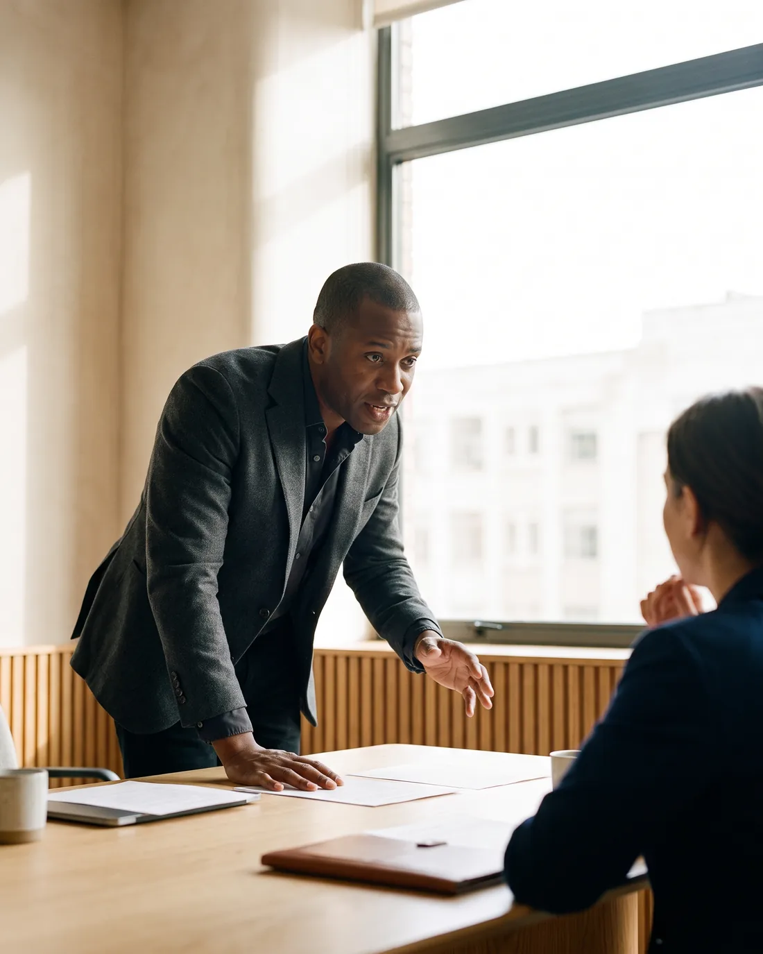 A senior CFO reviewing the work in a calm Dallas boardroom