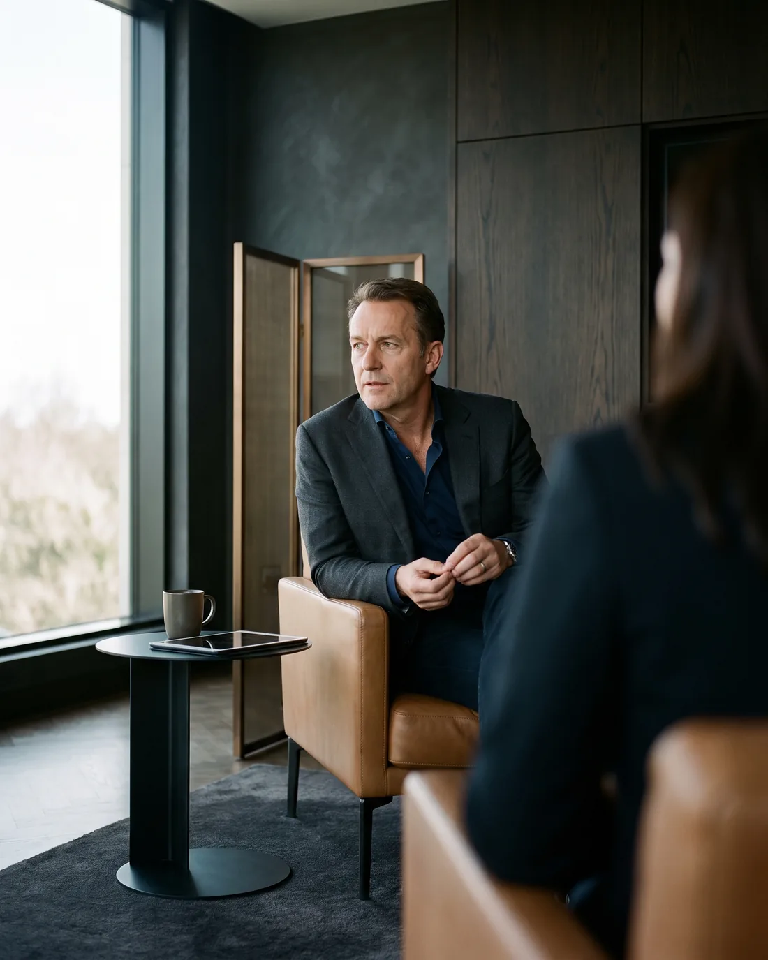 A senior CHRO reviewing the work in a calm Dallas boardroom